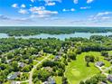 Beautiful aerial view of a waterfront community with lush greenery and lakeside homes at 132 Broadbill Dr, Mooresville, NC 28117