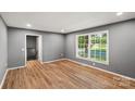 Living room featuring hardwood floors, a large window and neutral paint at 1510 Sansberry Rd, Charlotte, NC 28262
