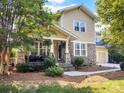 Charming two-story home with stone accents, inviting front porch, and well-maintained landscaping at 163 Shoreline Pkwy, Tega Cay, SC 29708