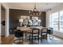 Dining room featuring modern lighting, wood accent wall, and stylish furnishings at 2195 Millennium Dr # 20, Lancaster, SC 29720