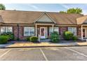 Brick condo with a well-manicured lawn and easy parking at 2785 Clover Nw Rd, Concord, NC 28027