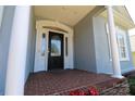Charming front porch with brick flooring and decorative glass door, perfect for welcoming guests at 406 Spyglass Hill Pl, Salisbury, NC 28144