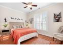Inviting bedroom featuring a comfortable bed, natural light, and a warm, welcoming ambiance at 407 Knops Nob Rd, Mooresville, NC 28115