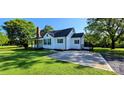 Well-kept exterior of a home with a green lawn and paved parking at 4501 E Highway 27 Hwy, Iron Station, NC 28080