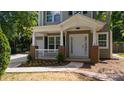 Inviting front porch with brick columns, white railings, and a well-maintained walkway at 8343 Highlander Ct, Charlotte, NC 28269
