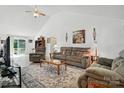 Spacious living room with vaulted ceilings, neutral walls, and a large area rug at 8529 Indian Summer Trl, Harrisburg, NC 28075