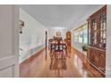 Formal dining room with hardwood floors, large windows, and chandelier lighting at 137 Proust Rd, Statesville, NC 28625