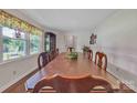Dining room showcasing a large table, hardwood floors, and bright natural light at 137 Proust Rd, Statesville, NC 28625