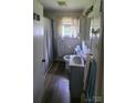 Functional bathroom with a sink, toilet, and shower/tub combination at 1512 Thompson Ave, Charlotte, NC 28216