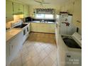 Efficient kitchen with appliances, ample counter space, and bright natural light at 1512 Thompson Ave, Charlotte, NC 28216