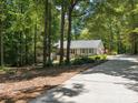 Charming home exterior with stone details, a welcoming driveway, and lush green surroundings at 1711 Apple Tree Ln # 28, Fort Mill, SC 29715