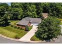 Aerial view showcasing the home's location within a tree-lined cul-de-sac at 2124 Congress Ct, Kannapolis, NC 28083