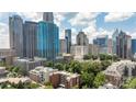 Enjoy breathtaking city views from this condo, showcasing iconic buildings and a vibrant urban landscape at 229 N Church St # 100, Charlotte, NC 28202