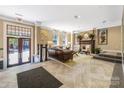Welcoming lobby with a comfortable seating area, fireplace, and elegant decor that creates a cozy atmosphere at 229 N Church St # 100, Charlotte, NC 28202