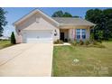 Charming one-story home with a well-manicured lawn and brick facade, creating curb appeal at 3006 Constitution Ln, Gastonia, NC 28056