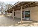 A covered back porch provides outdoor living space and shelter from the elements at 3607 Austin Rd, Monroe, NC 28112