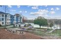 Scenic view of community amenities, including lake access, a clubhouse, and landscaped grounds at 4455 Reed Creek Dr # 306, Sherrills Ford, NC 28673