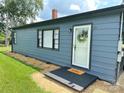 Inviting front entrance with a decorative wreath, welcome mat, and a fresh coat of paint at 60 White Oaks Dr, Taylorsville, NC 28681