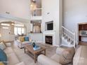 Spacious living room with high ceilings, fireplace, and open floor plan at 621 Pine Links Dr, Tega Cay, SC 29708