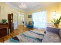 Inviting living room with bright natural light, hardwood floors, and comfortable seating at 6311 Red Maple Dr, Charlotte, NC 28277