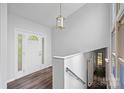 Bright foyer features wood floors, decorative chandelier and an arched front door with sidelights at 640 Lochaven Rd, Weddington, NC 28173