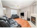 Relaxing living room featuring a fireplace, entertainment center, and comfortable couches at 7518 Silver Arrow Dr, Charlotte, NC 28273