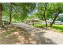 Charming home with a covered front porch, set amidst mature trees and a spacious yard at 909 Lakeview St, Kannapolis, NC 28083