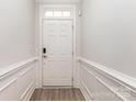 A bright entryway with clean white walls and stylish wood-look floors welcomes you at 101 Daybreak Ln, Belmont, NC 28012