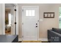 Bright entryway featuring white door, stylish decor, and a glimpse into the living area at 117 Franklin St, Clover, SC 29710