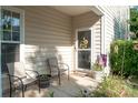 Cozy front porch featuring comfortable seating, decorative plants, and a welcoming entrance at 1304 Hammond Dr, Matthews, NC 28104