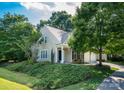Beautiful home exterior with lush landscaping, offering great curb appeal at 18439 Victoria Bay Dr, Cornelius, NC 28031