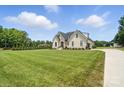 Home has mature trees and a well-manicured lawn, showcasing the property's desirable location at 19 Berea Baptist Church Rd, Stanfield, NC 28163