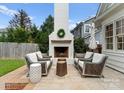 Outdoor patio area featuring a stylish fireplace and cozy seating, ideal for entertaining at 2015 Lombardy Cir, Charlotte, NC 28203