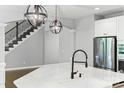Modern kitchen island with stainless steel appliances and elegant pendant lighting at 252 Broadleaf Dr, Denver, NC 28037