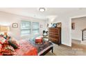 Cozy bedroom with hardwood floors, natural light, and vintage decor at 3006 Khan Park Dr # 69, Charlotte, NC 28206