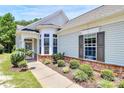 Inviting front entrance with stone accents, manicured landscaping, and a charming front porch, creating an appealing welcome at 3079 Azalea Dr, Fort Mill, SC 29707