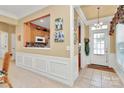 Inviting hallway with wainscoting, tile flooring, and views into the kitchen, offering a glimpse of the home's layout at 3079 Azalea Dr, Fort Mill, SC 29707