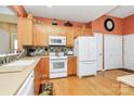 Bright kitchen features wood cabinets, modern appliances, and a spacious layout, perfect for culinary enthusiasts at 3079 Azalea Dr, Fort Mill, SC 29707
