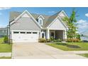 Charming single-Gathering home with a lush green lawn, two-car garage, gray siding, and inviting curb appeal at 507 Yucatan Dr # 71, Waxhaw, NC 28173