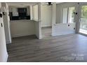 Open-concept living space with modern flooring, natural light, and deck access at 11123 Harrowfield Rd, Charlotte, NC 28226