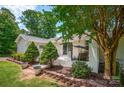 Comfortable front porch area with chairs and manicured landscaping; offering a relaxing outdoor space at 172 Wildwood Loop, Statesville, NC 28625