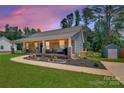 Charming home with a lovely porch, beautiful landscaping, and a freshly painted exterior at 1916 Bess Town Rd, Bessemer City, NC 28016