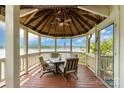 Picturesque gazebo with seating, offering stunning waterfront views, perfect for relaxation and entertaining at 216 Grand View Dr, New London, NC 28127