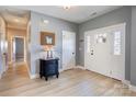 Bright foyer with wood floors, white trim, and a glimpse of the home's interior at 307 Stoneyard Rd, Richfield, NC 28137