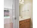 This functional powder room features a wooden vanity, a sink, and a well-lit mirror at 3830 Brookchase Ln, Charlotte, NC 28205
