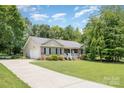 Well-maintained brick home with a spacious driveway and attached two-car garage at 551 Sand Trap Dr, York, SC 29745