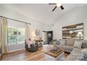 Bright living room with vaulted ceiling, hardwood floors, and stylish decor at 551 Sand Trap Dr, York, SC 29745