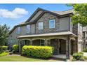 Charming two-story home featuring mixed siding, covered entryway with arched columns, and well-maintained lawn at 809 Ayrshire Ave, Fort Mill, SC 29708