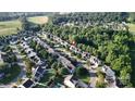 An aerial shot of a residential neighborhood showcasing the layout and proximity to green spaces at 119 Tilton Dr, Mooresville, NC 28115