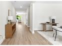 Bright entryway featuring hardwood floors, neutral walls, and ample space for furniture at 1227 Breezewood Dr, Charlotte, NC 28262